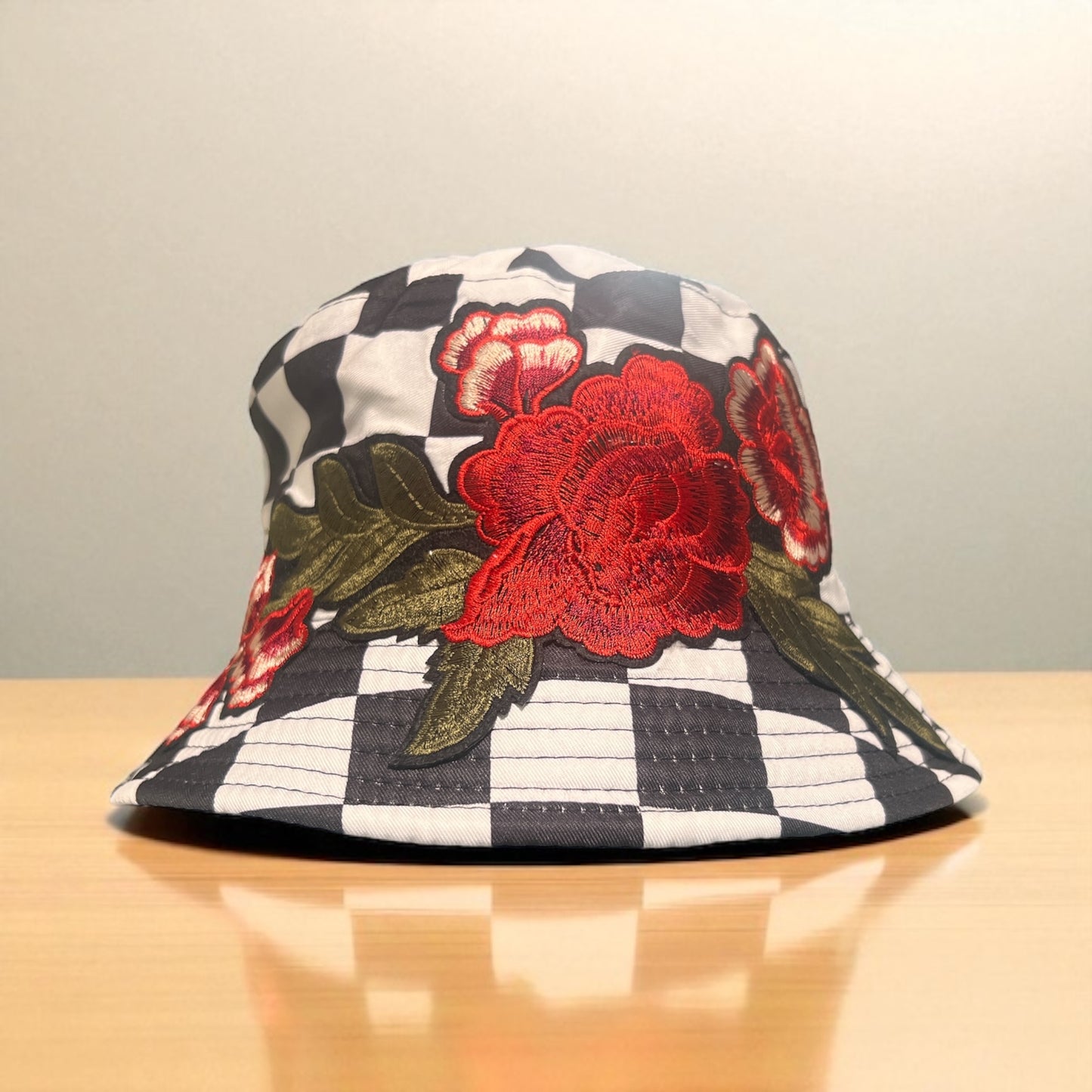 Checkered Bloom Bucket Hat – Black & White Checker Print with Red Floral Embroidery
