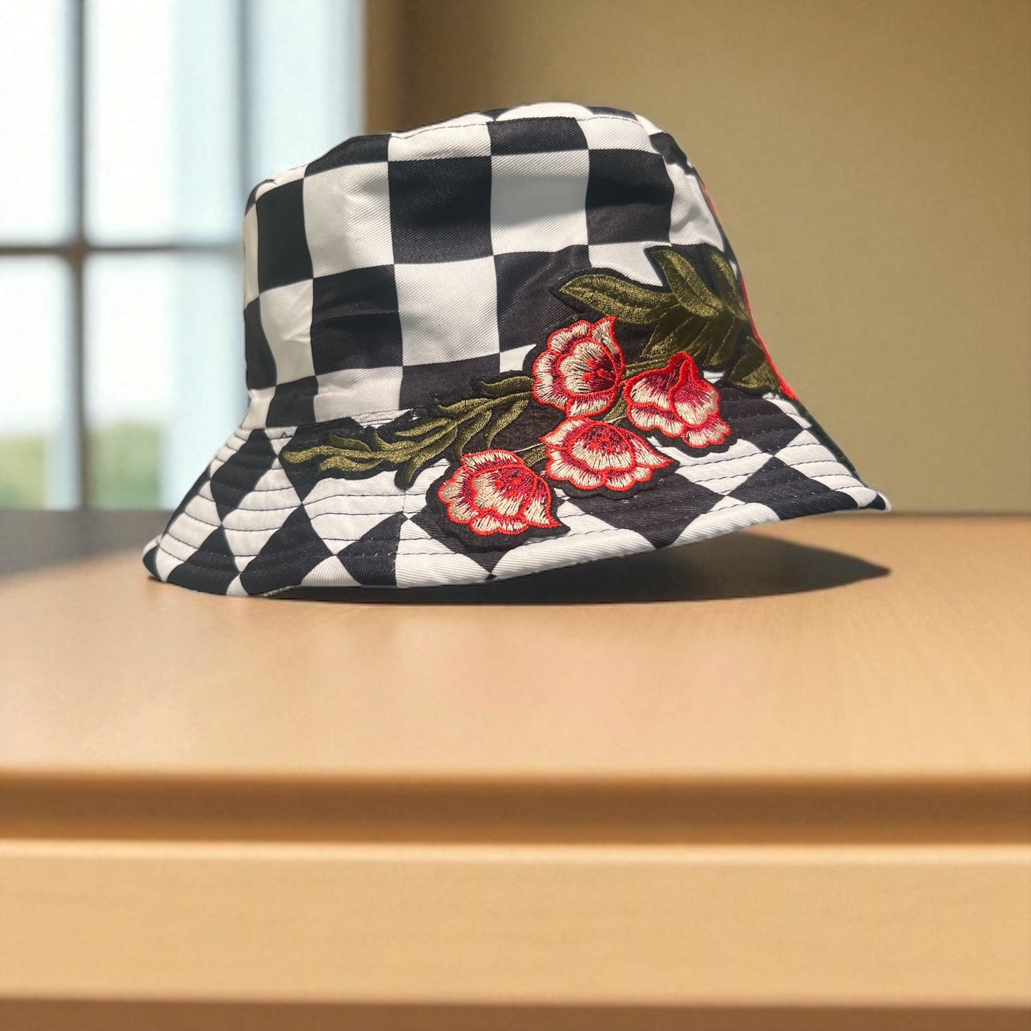 Checkered Bloom Bucket Hat – Black & White Checker Print with Red Floral Embroidery