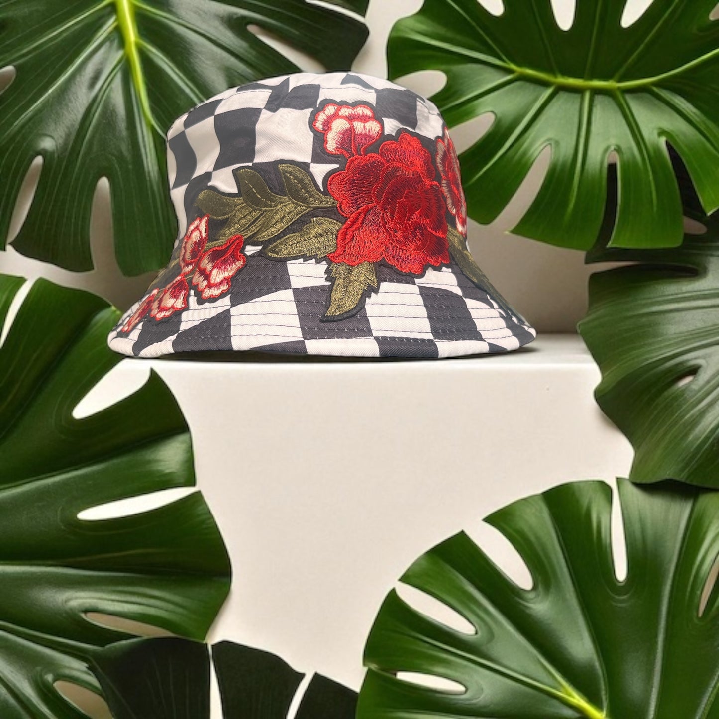 Checkered Bloom Bucket Hat – Black & White Checker Print with Red Floral Embroidery