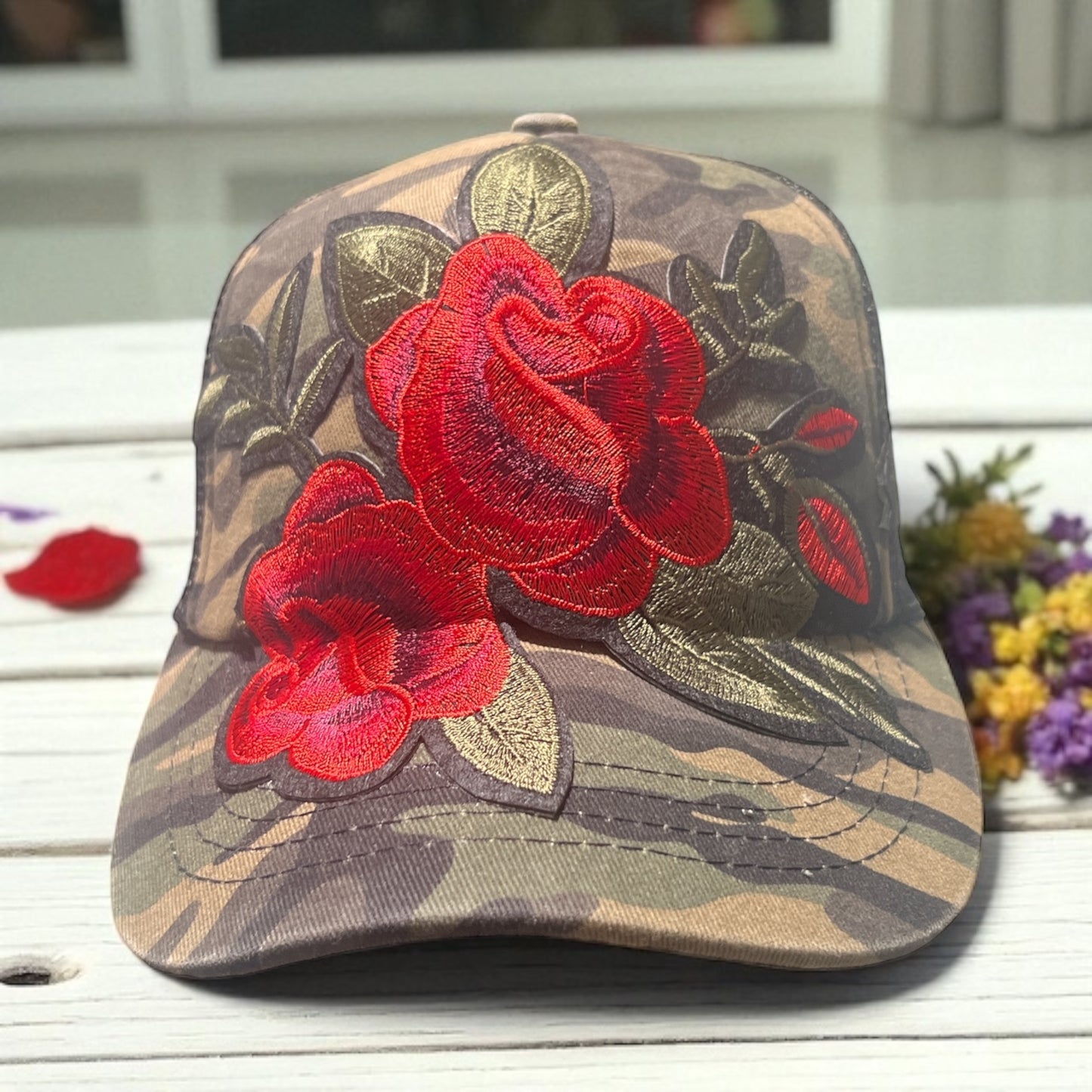 Camo Trucker Hat with Bold Red Floral Embroidery and Black Mesh Snapback